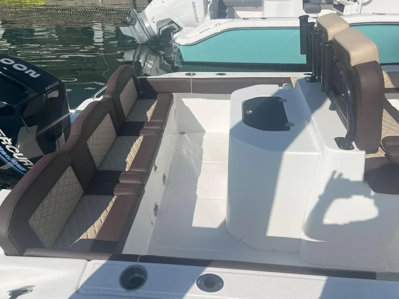 Slide: The Image of Spacious seating area on a 2026 Reflex Gladiator 2400 boat, featuring luxurious upholstery. - 8