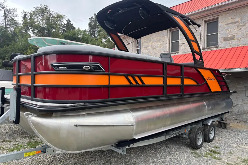Slide: The Image of 2026 Bentley Pontoons Elite 223 Swingback with Wake Tower, vibrant red and orange design. - 4