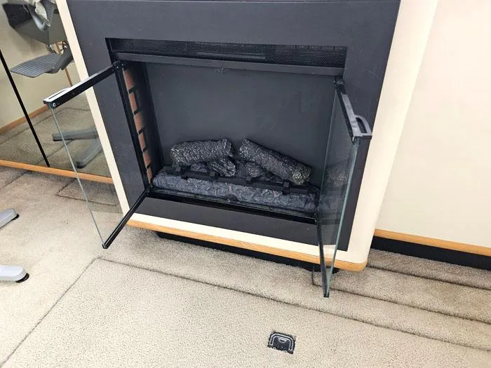 Slide: The Image of Fireplace with glass doors inside a 1990 Bayliner 4387 Motoryacht. - 13