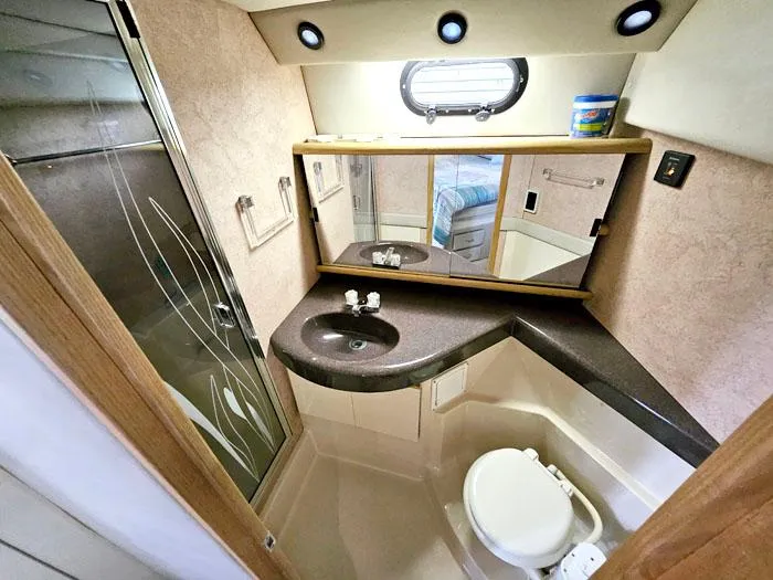 Slide: The Image of Bathroom interior of 1990 Bayliner 4387 Motoryacht with shower, sink, and toilet. - 23