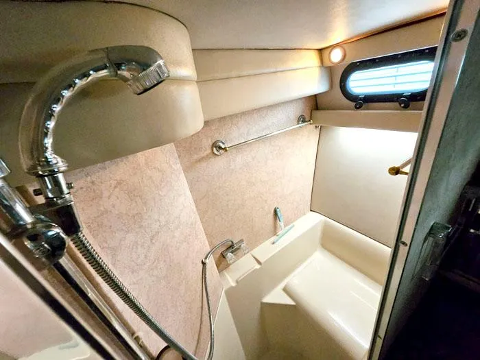 Slide: The Image of Bathroom interior of 1990 Bayliner 4387 Motoryacht with shower and window. - 24