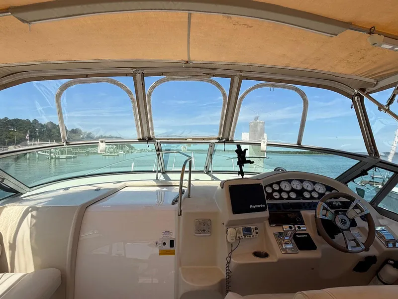Slide: The Image of Interior view of 2000 Cruisers Yachts 3375 Express helm with navigation equipment. - 5