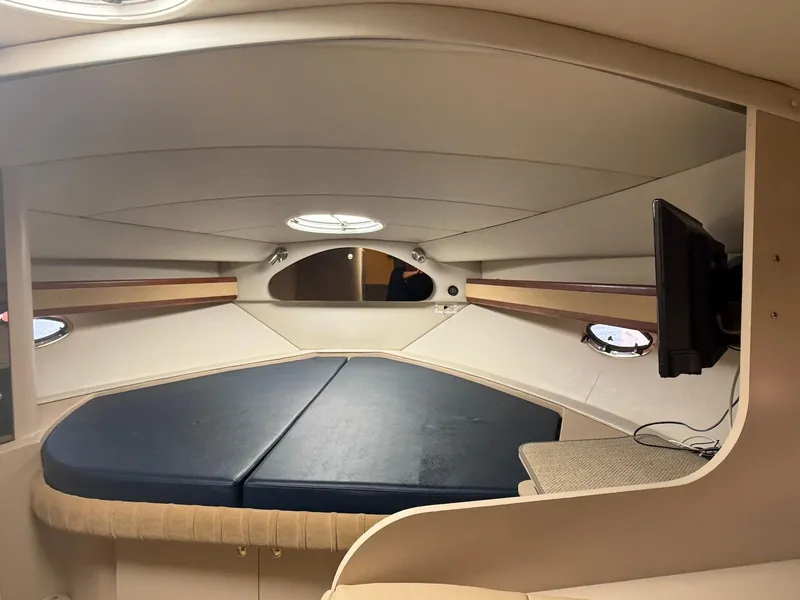 Slide: The Image of Interior cabin of 2000 Cruisers Yachts 3375 Express with bed and TV. - 19