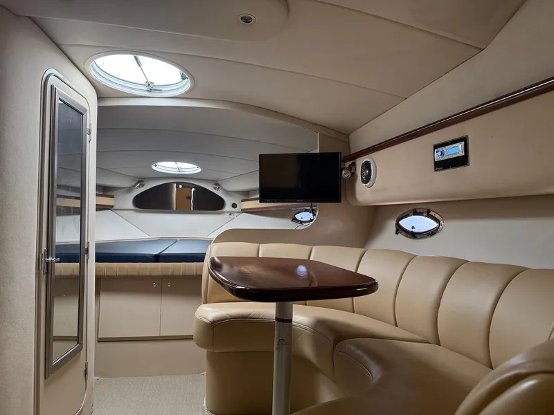Slide: The Image of Interior of 2000 Cruisers Yachts 3375 Express with beige seating and modern amenities. - 20