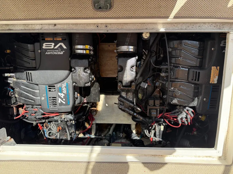 Slide: The Image of Engine compartment of a 2000 Cruisers Yachts 3375 Express, featuring dual MerCruiser V8 engines. - 30
