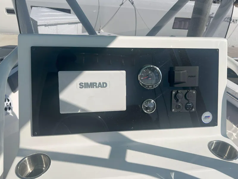 Slide: The Image of Control panel of Reflex Gladiator 2400 boat, featuring Simrad and Fusion equipment, 2026 model. - 12