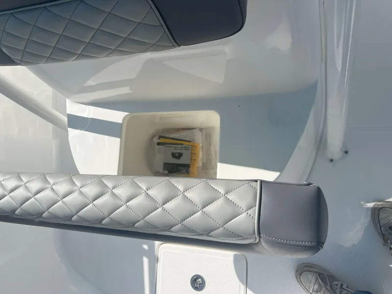 Slide: The Image of Quilted seats and storage compartment in Reflex Gladiator 2400 boat, 2026 model. - 15