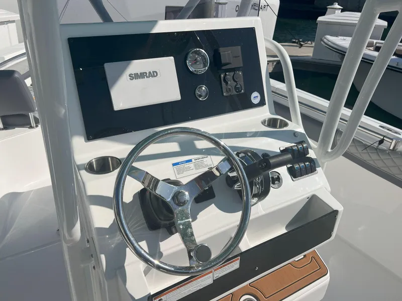 Slide: The Image of Boat steering console of Reflex Gladiator 2400, featuring Simrad electronics, 2026 model. - 27