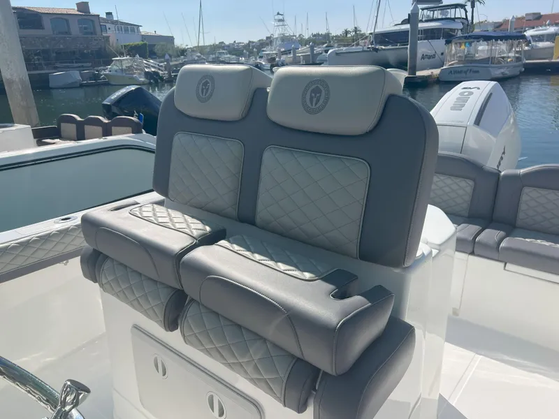 Slide: The Image of Luxury seating on Reflex Gladiator 2400 boat, docked at marina, 2026 model. - 28