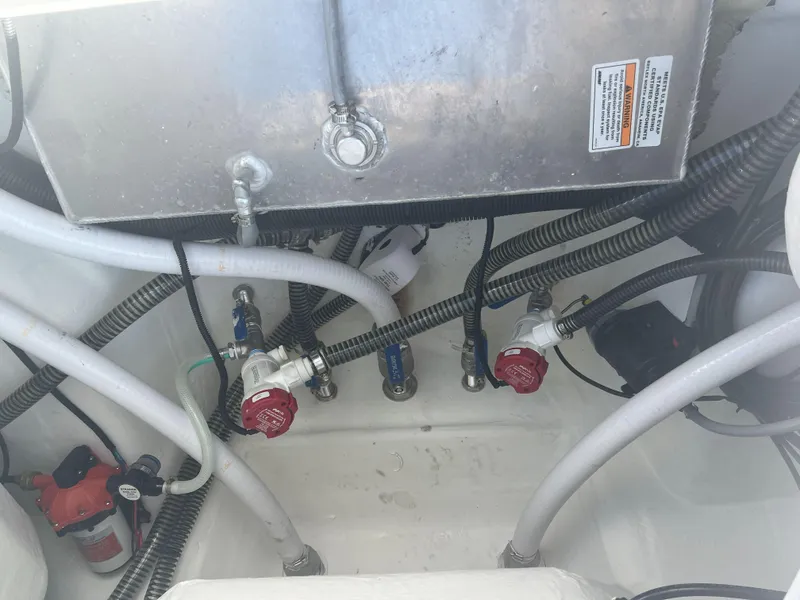 Slide: The Image of Boat engine compartment with hoses and valves, Reflex Gladiator 2400, 2026 model. - 34