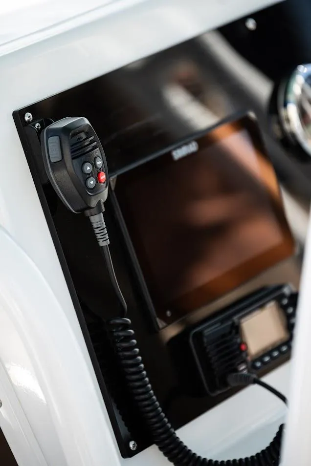 Slide: The Image of Control panel of Reflex Gladiator 2400 boat, featuring communication equipment, 2026 model. - 46