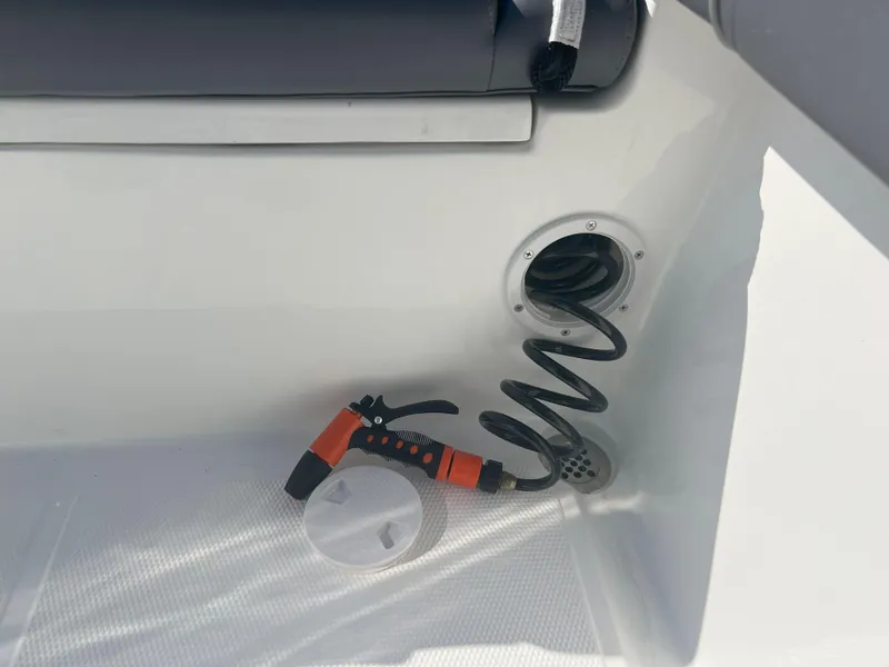 Slide: The Image of Coiled hose and nozzle in Reflex Gladiator 2400 boat, 2026 model. - 9