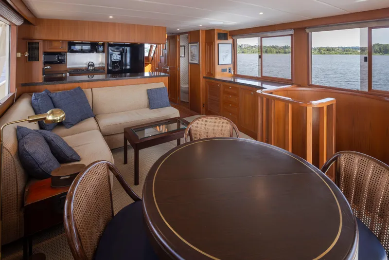 Slide: The Image of Luxurious interior of 2006 Alaskan 65 Flushdeck yacht with elegant wood finishes and comfortable seating. - 10
