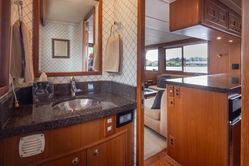 Slide: The Image of Luxurious interior of 2006 Alaskan 65 Flushdeck yacht with elegant wood and granite finishes. - 19