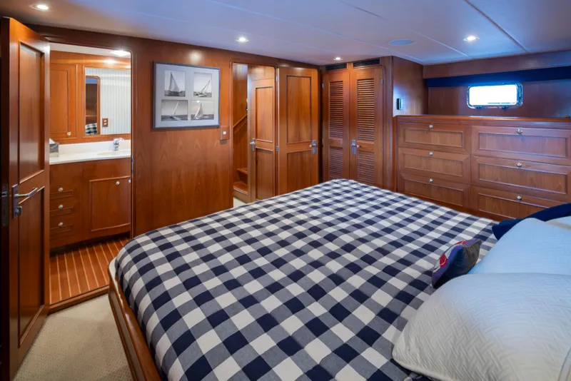 Slide: The Image of Luxurious cabin interior of 2006 Alaskan 65 Flushdeck yacht with checkered bedding. - 26
