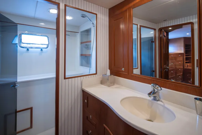 Slide: The Image of Luxurious bathroom in 2006 Alaskan 65 Flushdeck yacht with wood cabinetry and modern fixtures. - 29