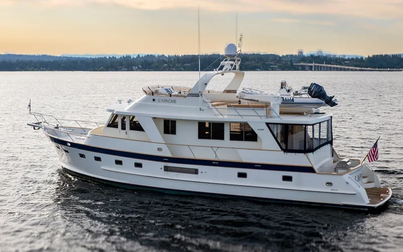 Slide: The Image of 2006 Alaskan 65 Flushdeck yacht cruising on calm waters at sunset. - 3