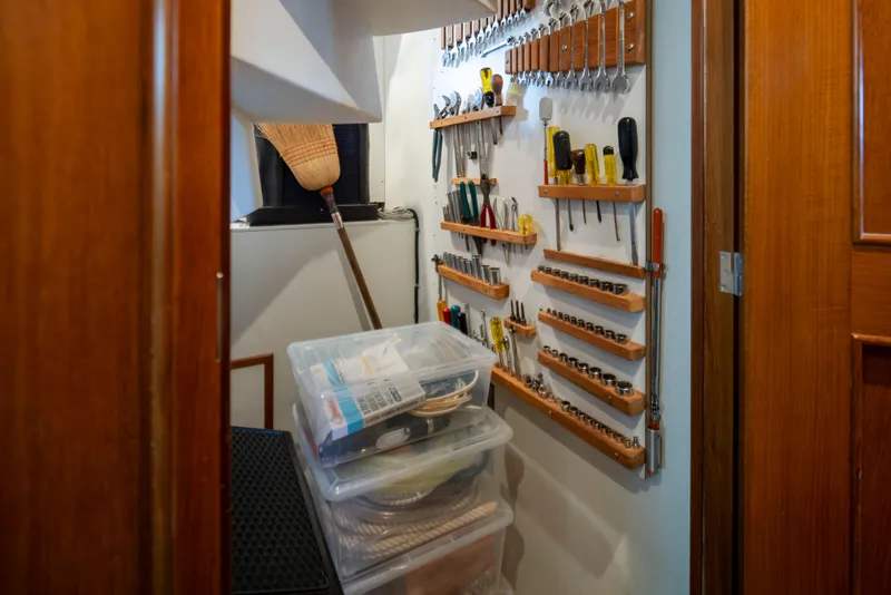 Slide: The Image of Tool storage area on Alaskan 65 Flushdeck, 2006, with organized shelves and containers. - 30