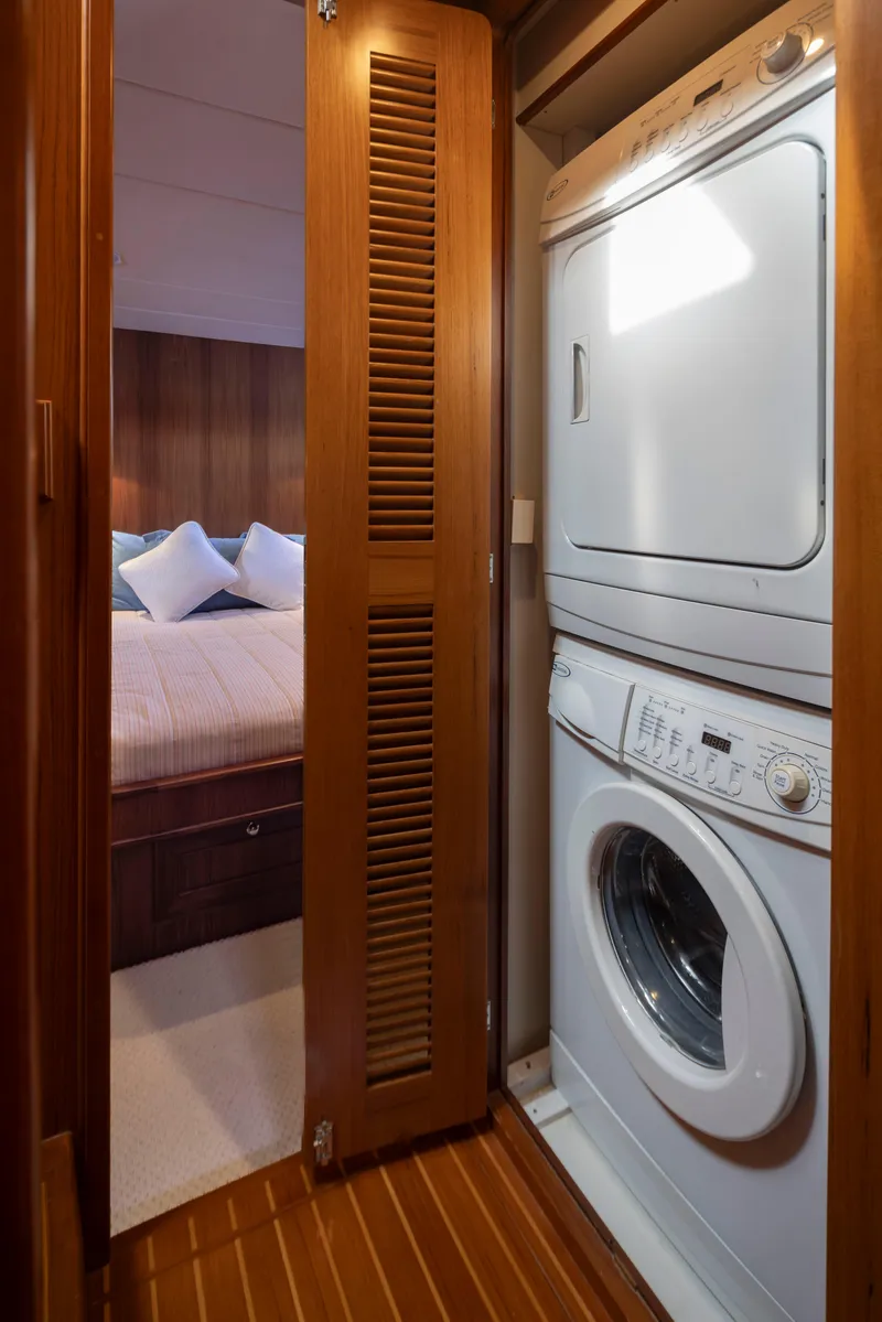 Slide: The Image of Laundry area in 2006 Alaskan 65 Flushdeck yacht with stacked washer and dryer. - 32