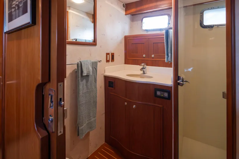 Slide: The Image of Bathroom interior of 2006 Alaskan 65 Flushdeck yacht with wooden cabinetry and shower. - 36