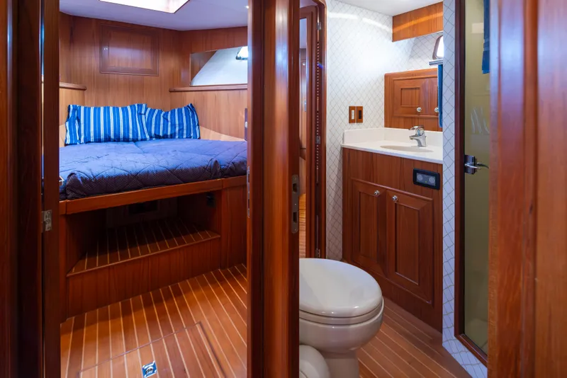 Slide: The Image of Luxurious 2006 Alaskan 65 Flushdeck yacht interior with cozy bedroom and modern bathroom. - 39