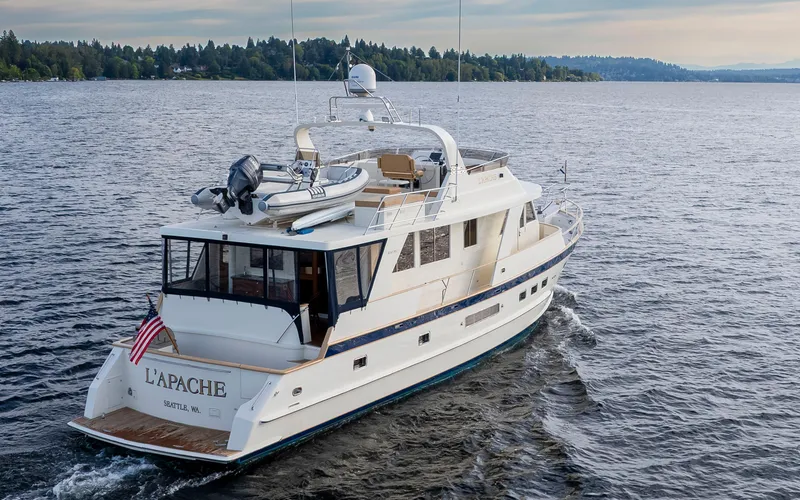 Slide: The Image of Alaskan 65 Flushdeck yacht cruising on a serene lake, 2006 model. - 4