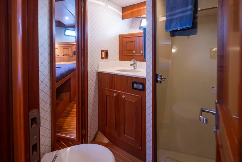 Slide: The Image of Luxurious bathroom interior of 2006 Alaskan 65 Flushdeck yacht with wood accents. - 42