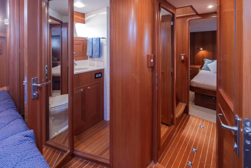 Slide: The Image of Luxurious 2006 Alaskan 65 Flushdeck yacht interior with wood paneling and modern amenities. - 44