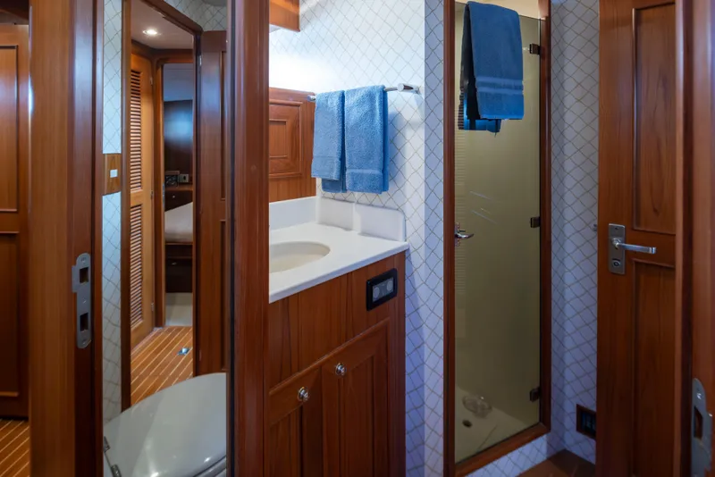 Slide: The Image of Luxurious bathroom in 2006 Alaskan 65 Flushdeck yacht with wooden cabinetry and modern fixtures. - 45