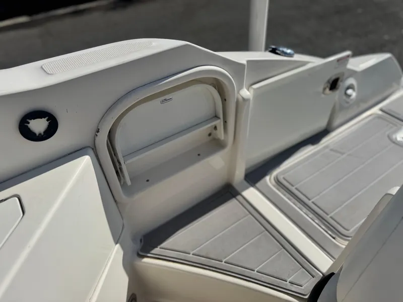 Slide: The Image of 2015 Sea Ray 270 SDX boat interior with storage compartments and non-slip flooring. - 13