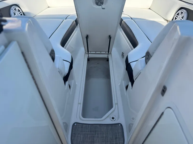 Slide: The Image of 2015 Sea Ray 270 SDX boat interior storage compartment with open hatch. - 19