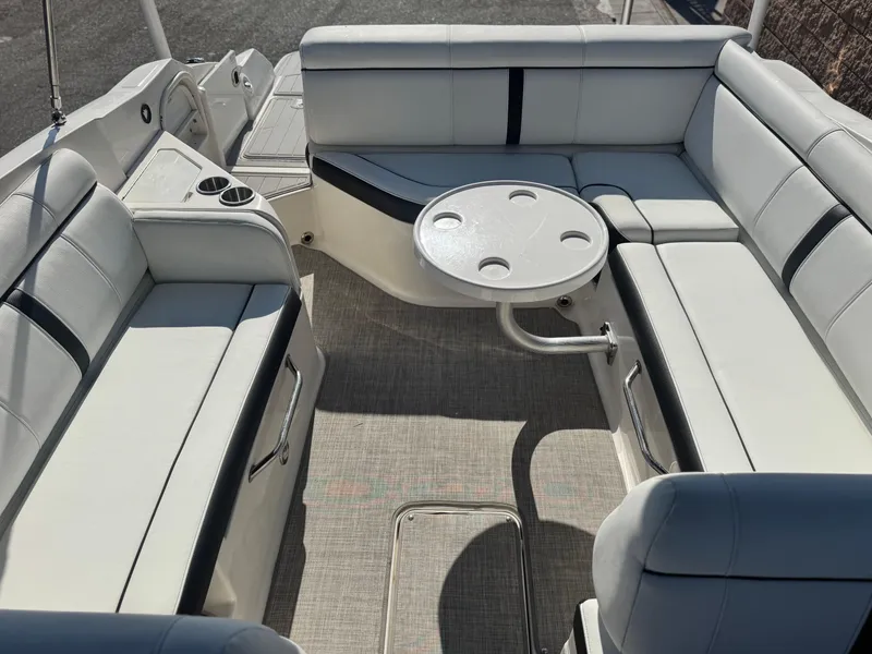 Slide: The Image of Interior of 2015 Sea Ray 270 SDX boat with spacious seating and table. - 23