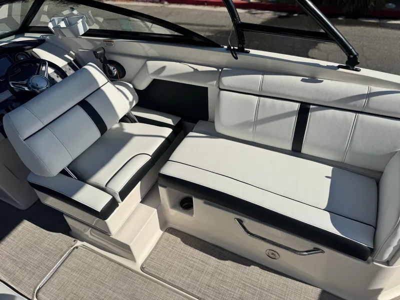 Slide: The Image of Interior of 2015 Sea Ray 270 SDX boat with white and black seating. - 24