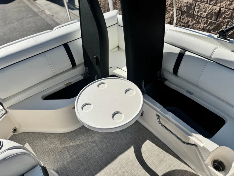 Slide: The Image of Interior of 2015 Sea Ray 270 SDX boat with seating and round table. - 29