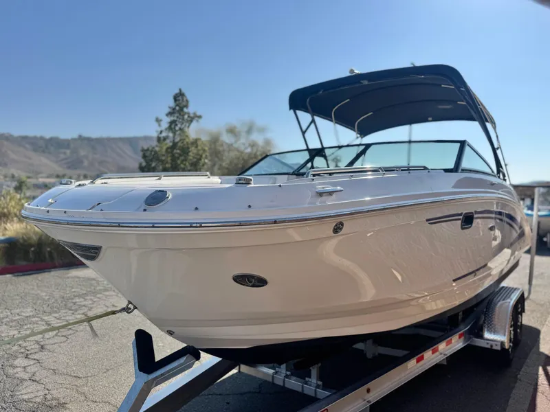 Slide: The Image of 2015 Sea Ray 270 SDX boat on trailer, sunny day, scenic background. - 3