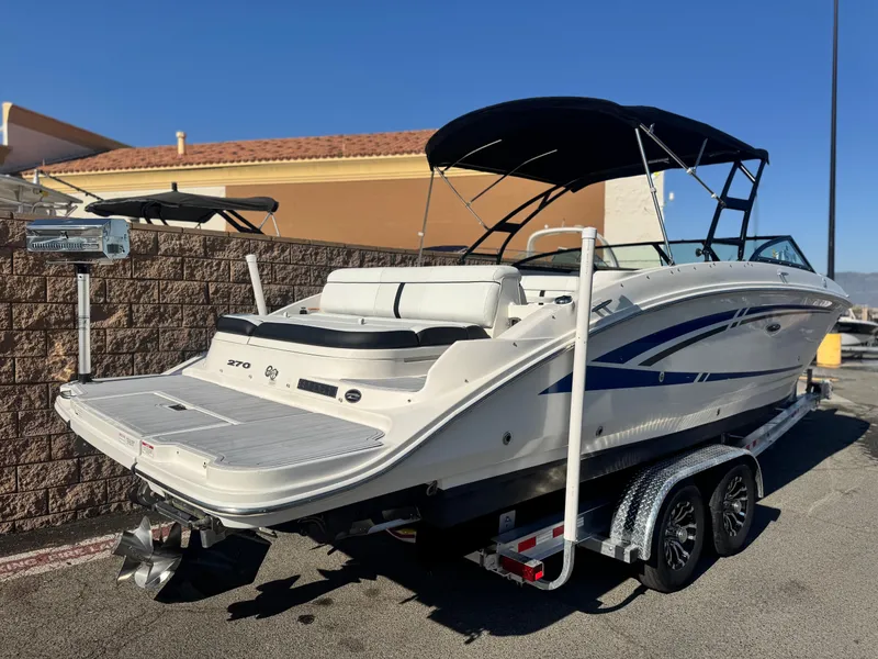 Slide: The Image of 2015 Sea Ray 270 SDX boat on trailer, featuring sleek design and spacious seating. - 5