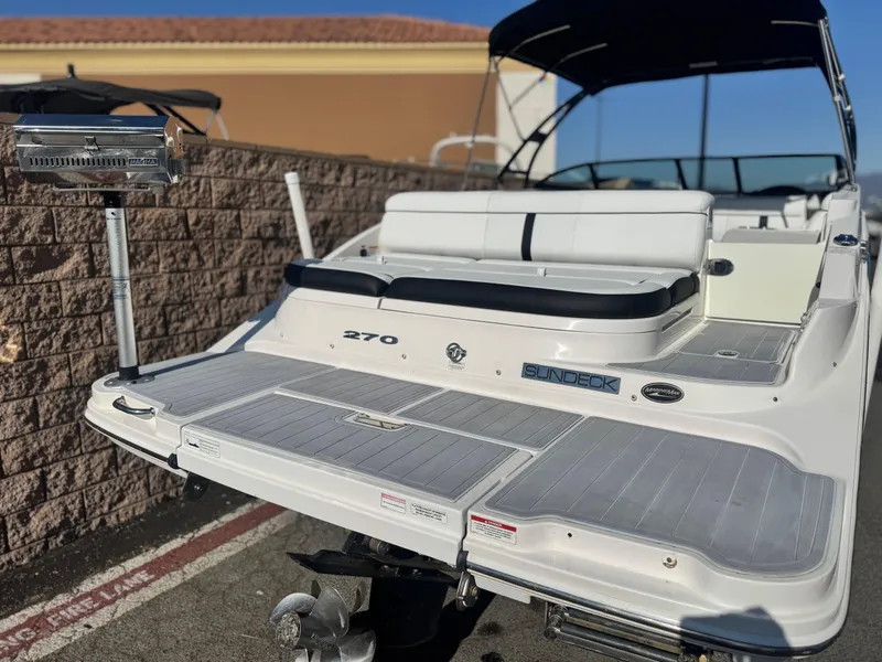 Slide: The Image of 2015 Sea Ray 270 SDX boat with spacious deck and seating. - 6