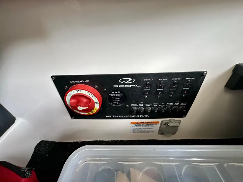 Slide: The Image of Battery management panel of 2023 Regal 2800 Bowrider boat with switches and controls. - 19
