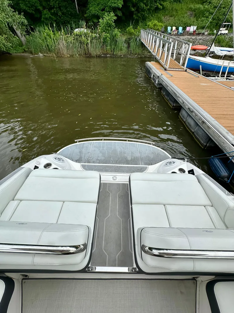 Slide: The Image of 2023 Regal 2800 Bowrider at dock, featuring spacious seating and sleek design. - 4