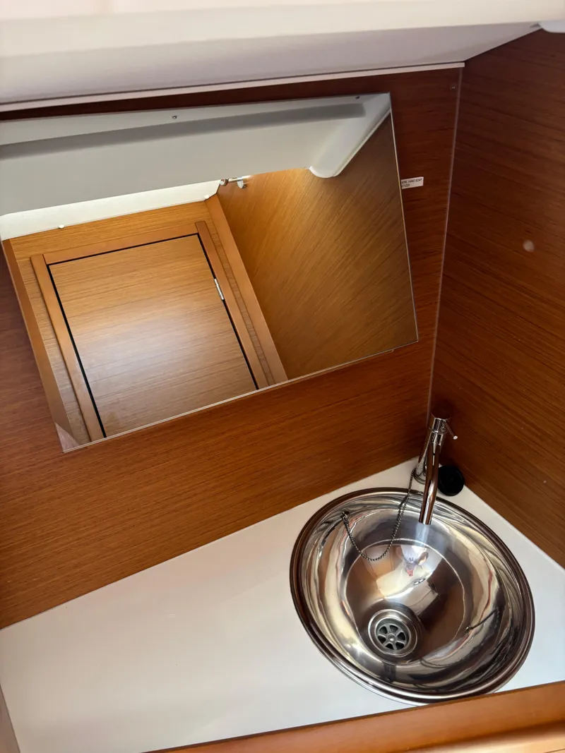 Slide: The Image of Interior of 2021 Jeanneau Sun Odyssey 349 yacht bathroom with sink and mirror. - 15