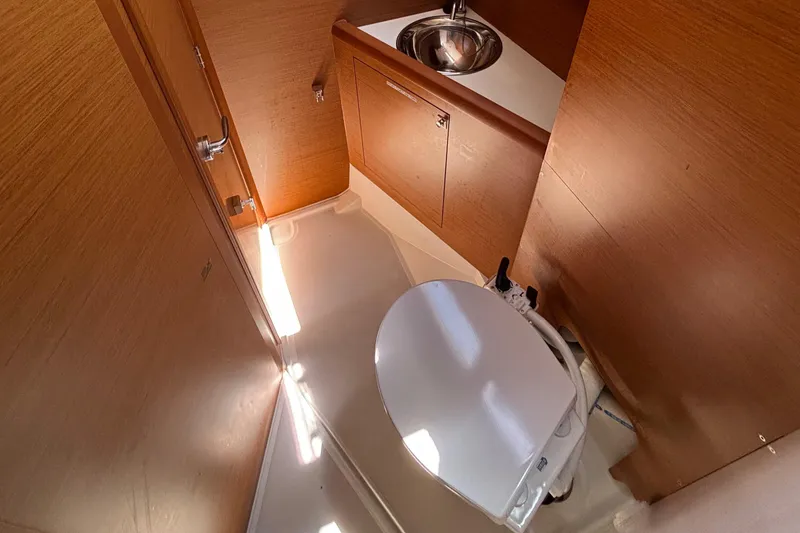 Slide: The Image of Interior of 2021 Jeanneau Sun Odyssey 349 yacht bathroom with sink and toilet. - 16