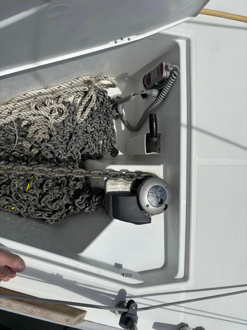 Slide: The Image of Anchor locker of 2021 Jeanneau Sun Odyssey 349 with chain and rope. - 24