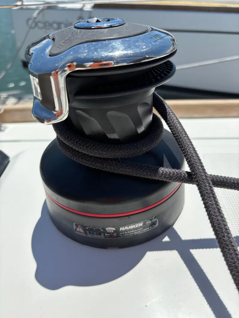 Slide: The Image of Winch on Jeanneau Sun Odyssey 349 sailboat, 2021 model, with rope wrapped around it. - 26