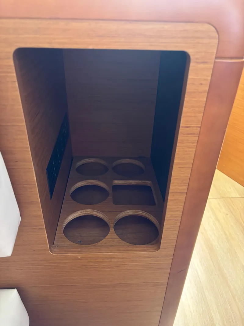 Slide: The Image of Cup holder compartment in Jeanneau Sun Odyssey 349, 2021 model, wooden interior design. - 28
