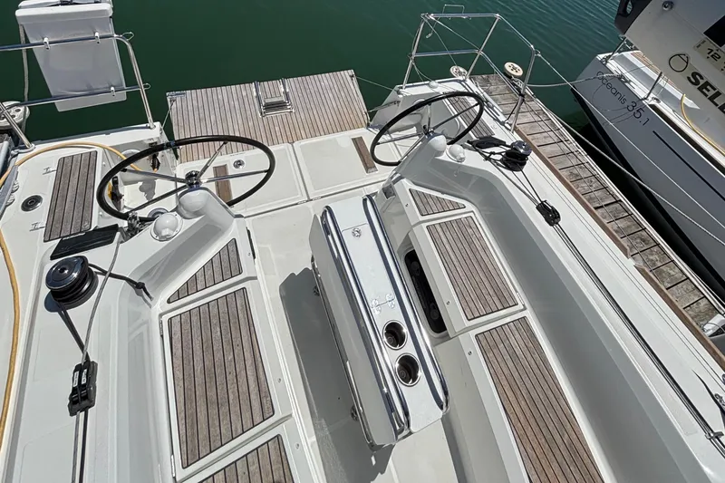 Slide: The Image of Cockpit view of 2021 Jeanneau Sun Odyssey 349 sailboat with dual steering wheels. - 9