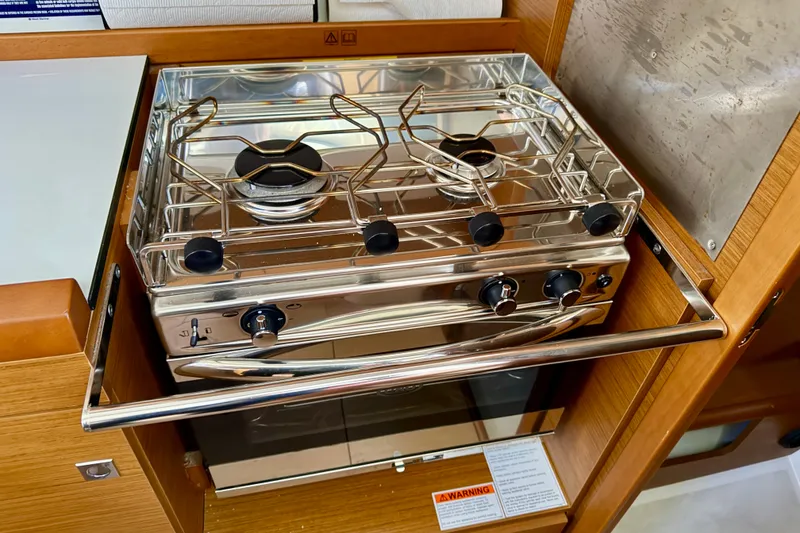 Slide: The Image of Modern kitchen stove in 2021 Jeanneau Sun Odyssey 349 yacht galley. - 35