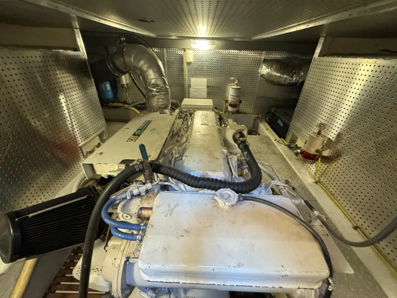 Slide: The Image of Engine room of a 2003 President Performance Trawler with visible machinery and components. - 13