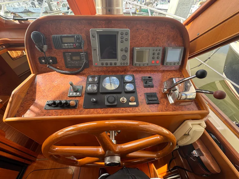 Slide: The Image of Helm of 2003 President Performance Trawler with navigation and control instruments. - 5
