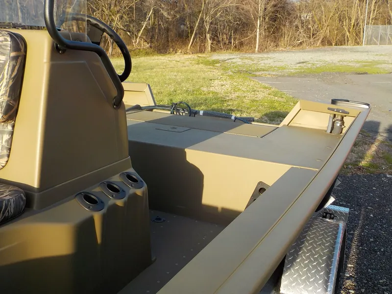 Slide: The Image of G3 Gator Tough 18 CC 2025 boat on trailer outdoors. - 7