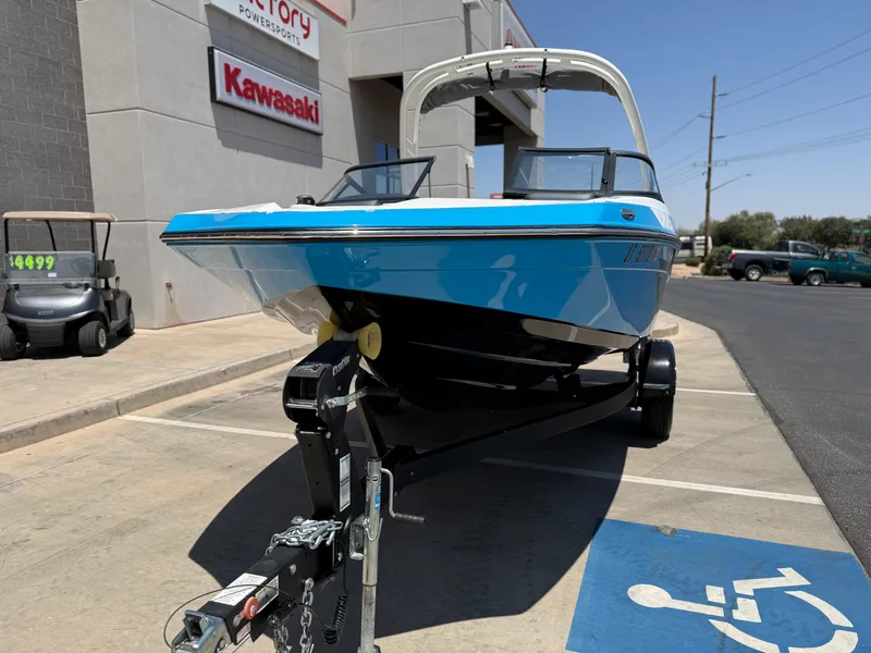 Slide: The Image of 2021 Yamaha AR195 boat on trailer in dealership parking lot. - 13